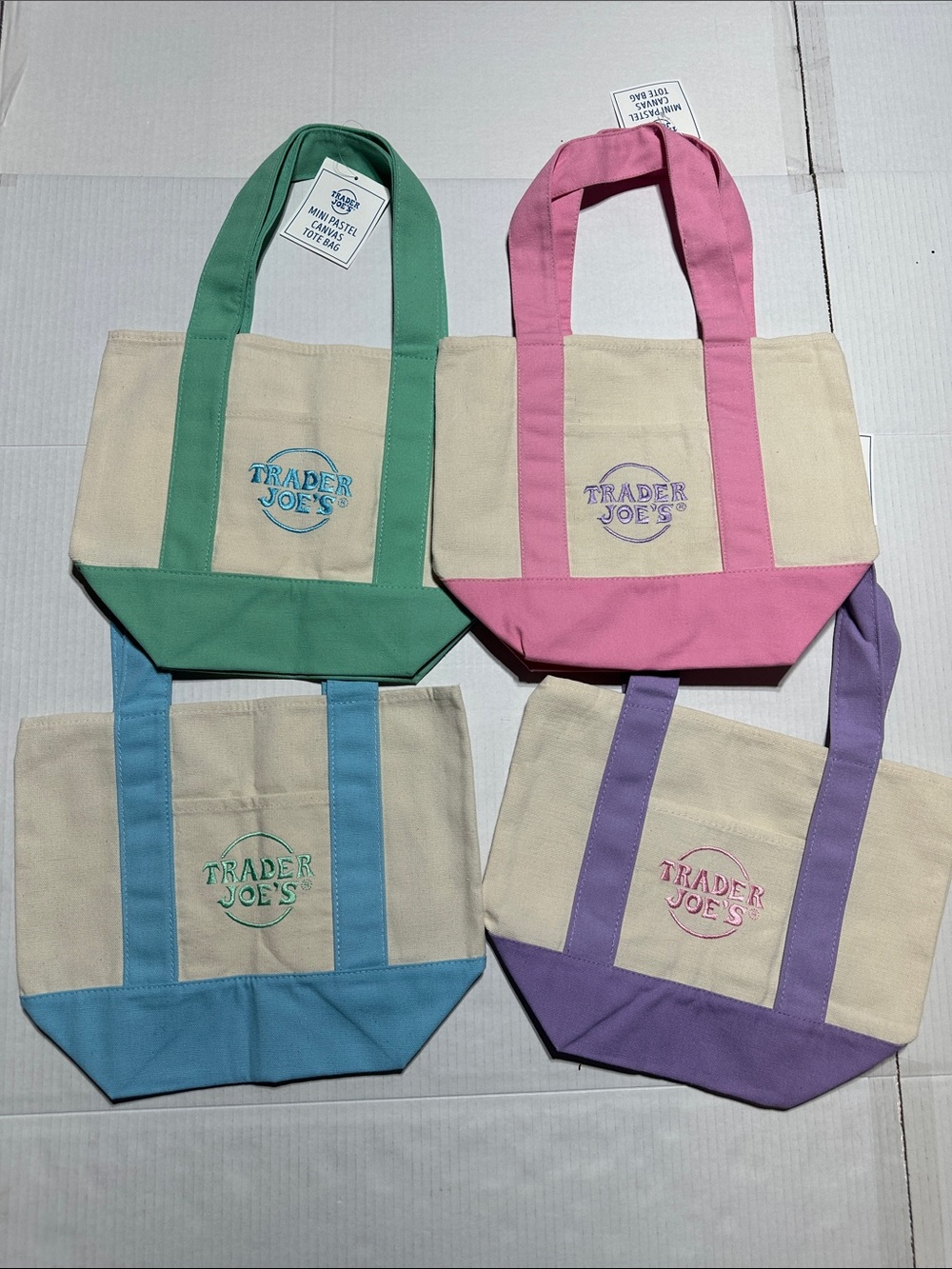 NWT Trader Joe’s set of 4 mini pastel canvas tote bags in blue pink lilac & aqua